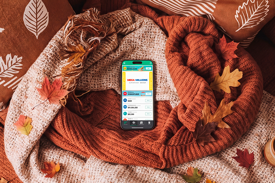 Phone framed by fall leaves for an article on 6 Fall-Inspired Numbers