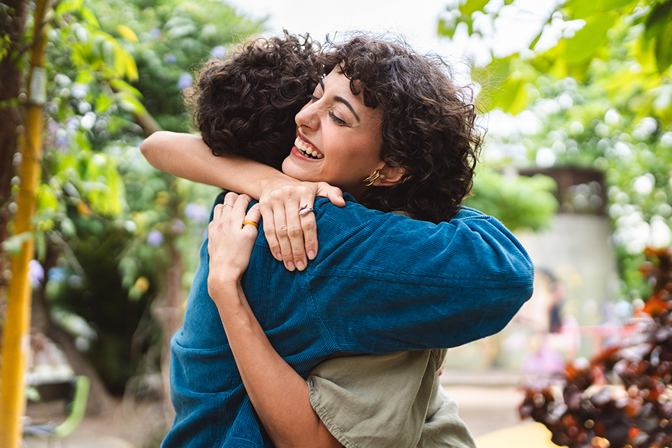 Couple hugging outdoors in a story about lottery winners who donated their winnings